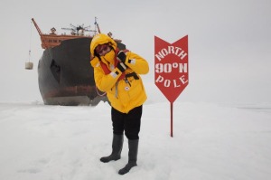 Nick Smith at a ceremonial North Pole with the Russian nuclear icebreaker '50 Years of Victory' in the background
